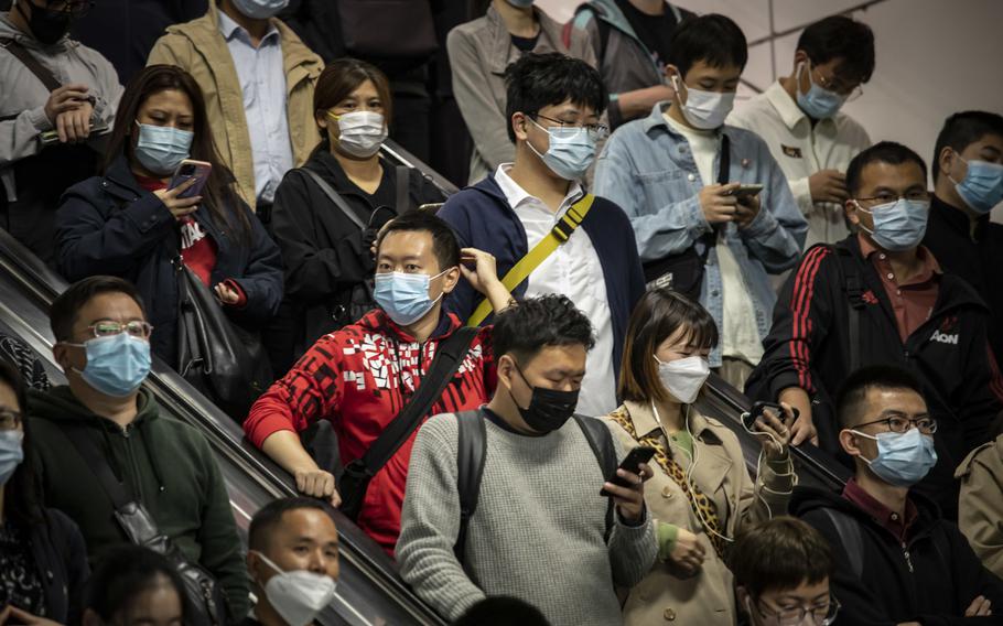 Commuters at a subway station in Shanghai on Oct. 10, 2022.