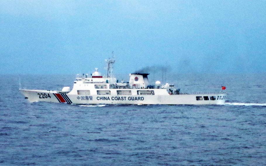 Tokyo says China coast guard vessel 2204, seen here in November 2022, appeared to be armed with a deck-mounted machine gun when it entered Japanese territorial waters in the East China Sea, Friday, Feb. 24, 2023.