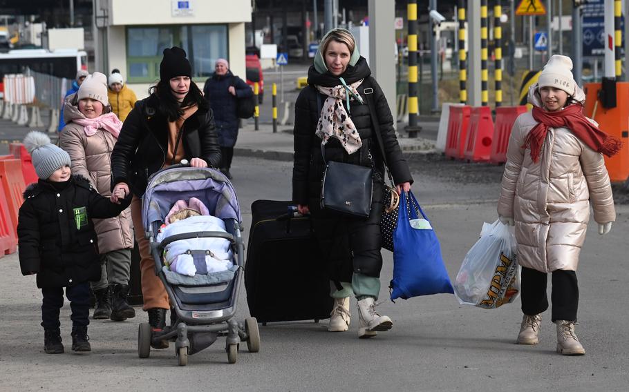 Refugees cross the Ukrainian-Polish border at Medyka, Poland, March 2, 2022. More than 1 million people have fled Ukraine since Russia’s full-scale invasion last week, according to the United Nations.