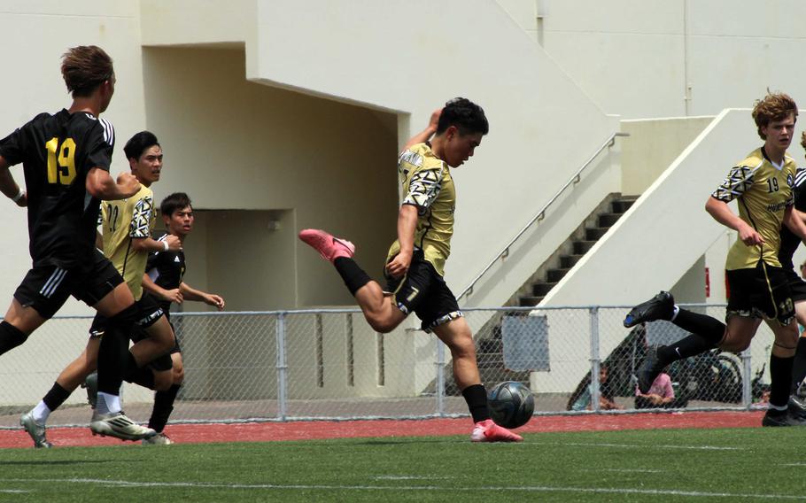 Humphreys' Lee Gunn kicks the ball upfield against Kadena.
