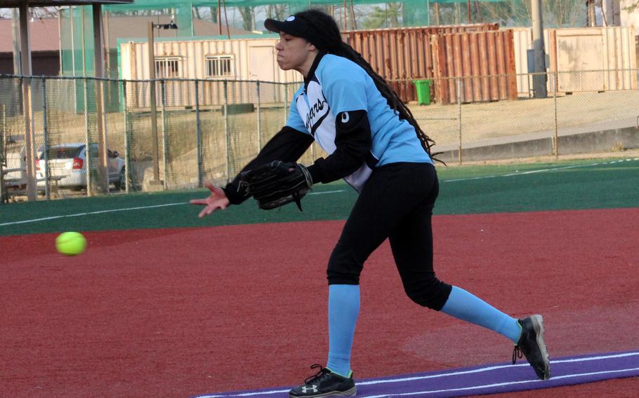 Osan right-hander Zephaniah Martin delivers against Humphreys during Wednesday’s DODEA-Korea softball doubleheader. The Cougars won the opener 9-7 and the teams played to a 13-13 draw in the nightcap.