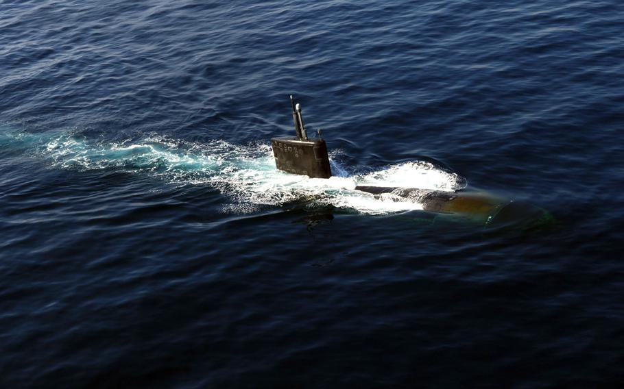 The Los Angeles-class nuclear-powered fast-attack submarine USS Miami (SSN 755) surfaces in the North Arabian Sea during an anti-submarine warfare exercise with the Enterprise Carrier Strike Group.
