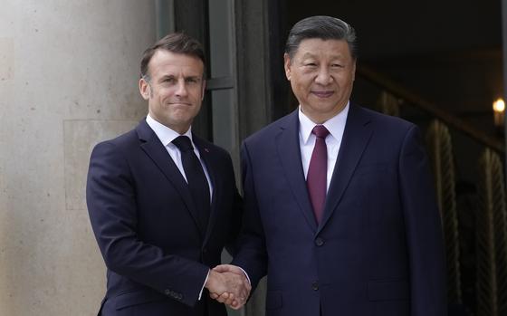 French President Emmanuel Macron shakes hands with China's President Xi Jinping before meeting in Paris on May 6, 2024.