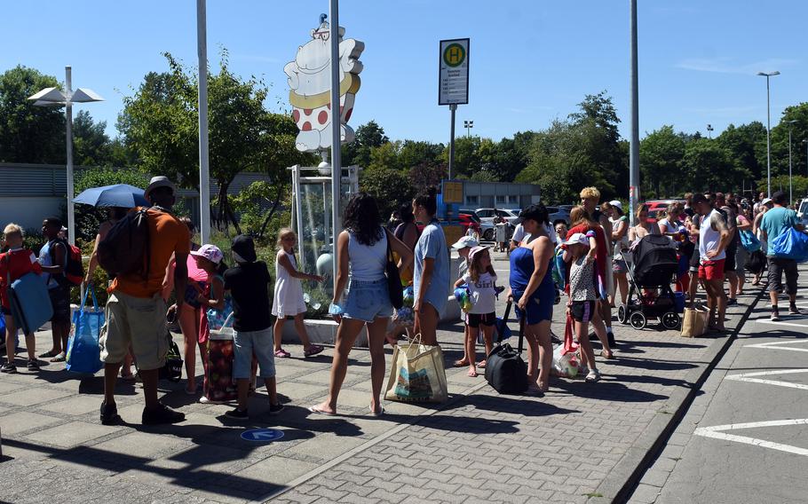 The line to get into the Azur swimming pool near Ramstein Air Base, Germany, was long Tuesday, July 19, 2022, during what was the hottest day Germany has recorded this year. A heat wave has hit much of Europe, with U.S. bases coping by curtailing physical activity and work schedules in some places. 