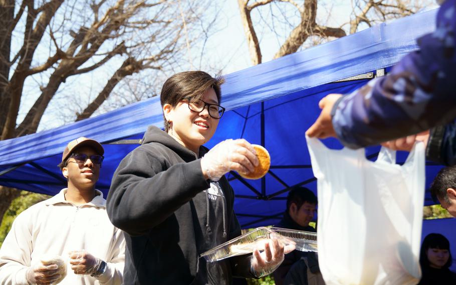Sixteen service members and two Air Force spouses joined 40 members of End of The Earth Mission Church in Tokyo to feed and clothe homeless people in the city’s Ueno Park, March 15, 2024.
