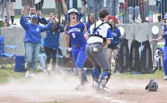 Ramstein's Natalie Briceland and the team's fans celebrate after she scored the winning run in the bottom of the seventh inning of the DODEA-Europe Division I softball championship game Saturday, May 20, 2023, at Kaiserslautern, Germany.