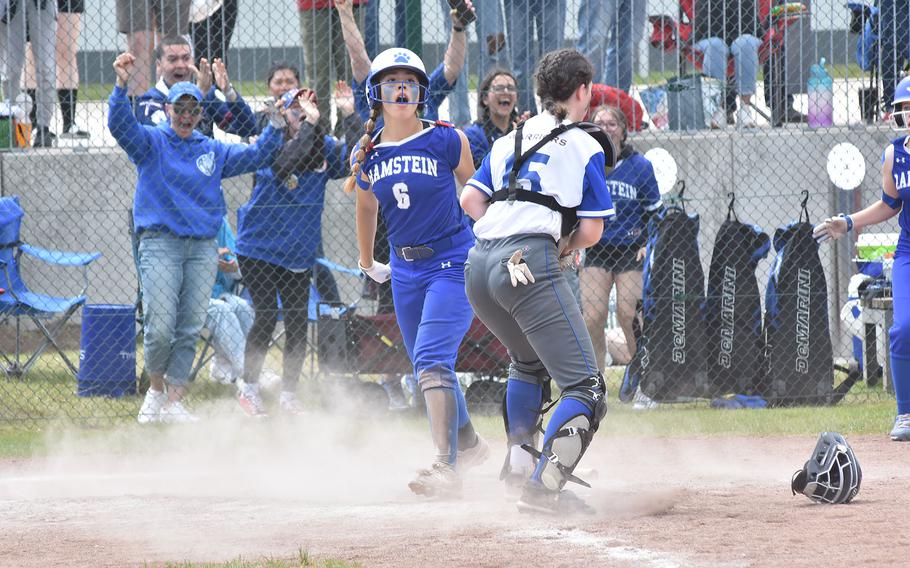 Ramstein's Natalie Briceland and the team's fans celebrate after she scored the winning run in the bottom of the seventh inning of the DODEA-Europe Division I softball championship game Saturday, May 20, 2023, at Kaiserslautern, Germany.