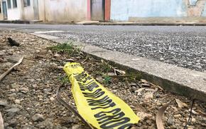 Police left a piece of barricade tape where a Marine was stabbed in the Henoko district of Nago city, Okinawa, May 29, 2024. 