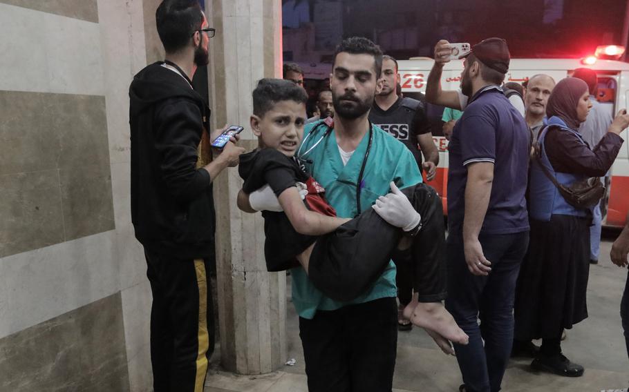 Palestinians injured in Israeli raids arrive at Nasser Medical Hospital on Monday, Nov. 14, 2023, in Khan Yunis, Gaza. Heavy fighting rages in the northern Gaza Strip as Israel encircles the area, despite increasingly pressing calls for a ceasefire.