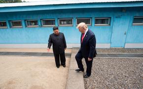 North Korean leader Kim Jong Un invites President Donald Trump to step across the border during a meeting at the Joint Security Area of the Demilitarized Zone, June 30, 2019.
