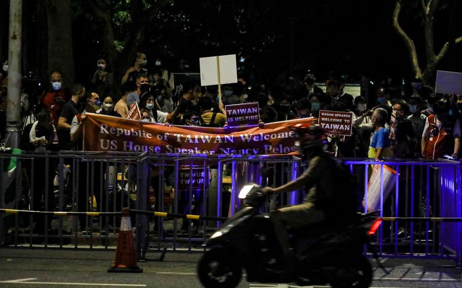 Supporters await a convoy carrying U.S. House Speaker Nancy Pelosi outside the Grand Hyatt hotel in Taipei, Taiwan, on Aug. 2, 2022.