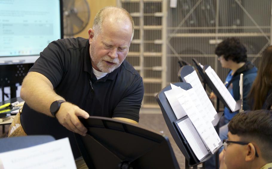 Brad Harzman, band director for Camp Zama Middle/High School, works with his students at the Army post outside Tokyo, Oct. 19, 2023.