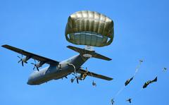 Army paratroopers assigned to the 173rd Airborne Brigade jump from an 86th Air Wing C-130 Hercules aircraft onto Juliet Drop Zone in Italy, April 12, 2022. Army paratroopers will be conducting airborne operations stretching from the Artic to the Balkans in the coming days, during a training exercise dubbed Swift Response. 