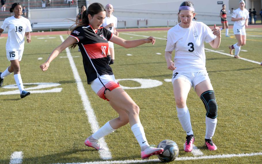 Joanna Hall and Maisey Throop battle for the ball.