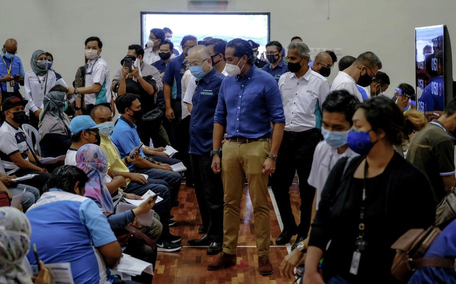 Khairy Jamaluddin, Malaysia's minister of science, technology and innovation, visits a COVID-19 vaccine program for sailors and port workers at the LPK Social and Recreation Club Multi-Purpose Hall Vaccinations Centre in Port Klang, Selangor, Malaysia, on June 25, 2021.