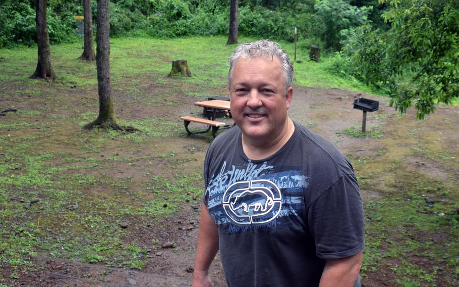 Tama Hills manager George DeGrella poses at a camp site during a tour of the U.S. military recreation area in western Tokyo, Saturday, July 1, 2023. 