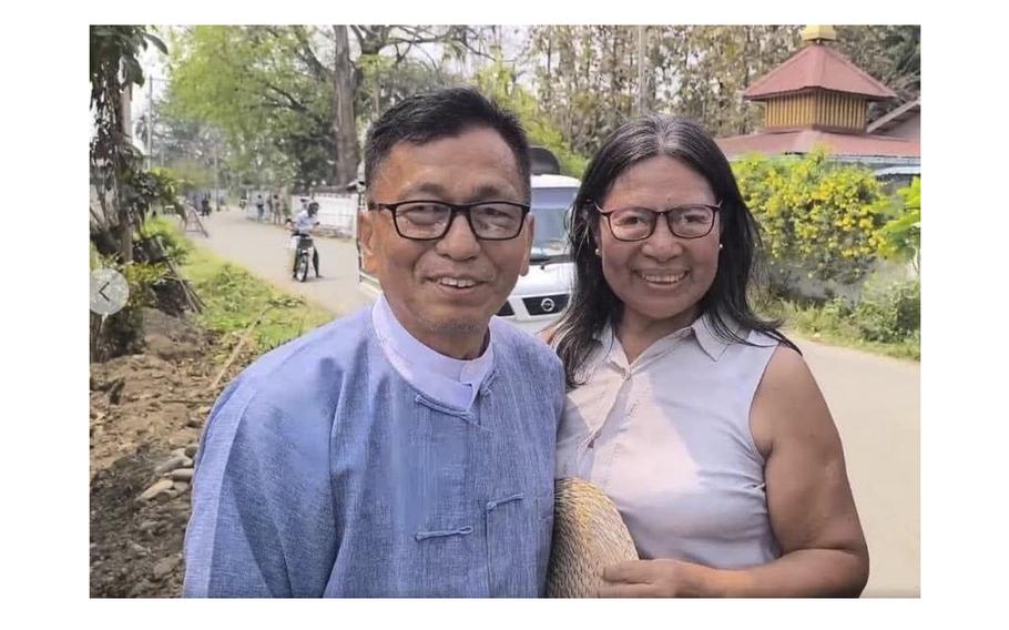 Hkalam Samson stands beside his wife after his release from the prison in Myintkyina township in Kachin state, Myanmar on Wednesday, April 17, 2024. Samson was detained by the authorities just hours after he was released from prison, according to a relative, a colleague and local media.