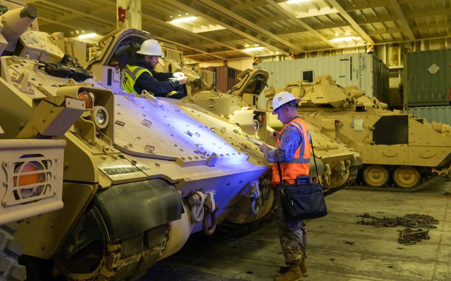 Army Sgt. Ryan Townsend helps prepare a Bradley Fighting Vehicle for overseas transport in North Charleston, S.C., Jan. 25, 2023. More than 60 Bradleys were shipped by U.S. Transportation Command as part of the American military aid package to Ukraine.