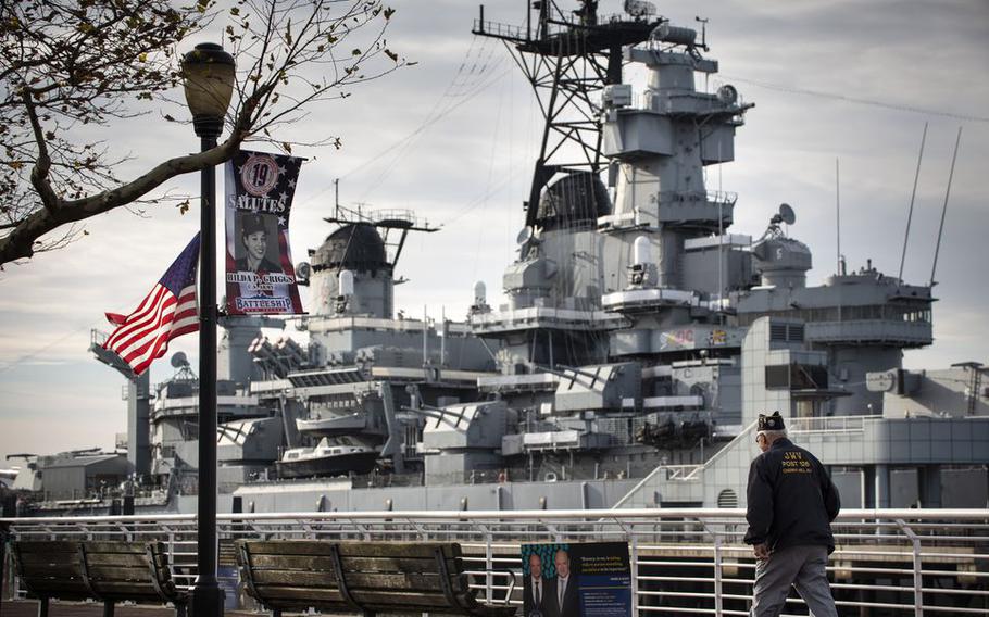 A military veteran walks toward the Battleship New Jersey, where a Pearl Harbor Day Commemoration ceremony took place, presented by the Camden County Board of Commissioners & Gloucester County Board of Commissioners.