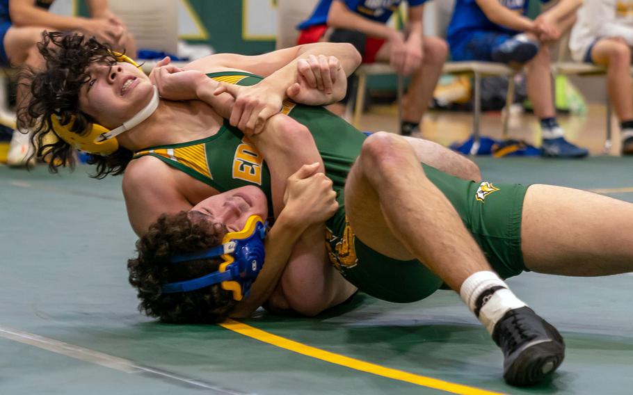 Robert D. Edgren's Sidney Cogswell locks in a head-and-arm hold on Yokota's Colin Kirby at 158 pounds during Saturday's DODEA-Japan wrestling tri-meet. Cogswell pinned Kirby and the Eagles won the meet 23-14.