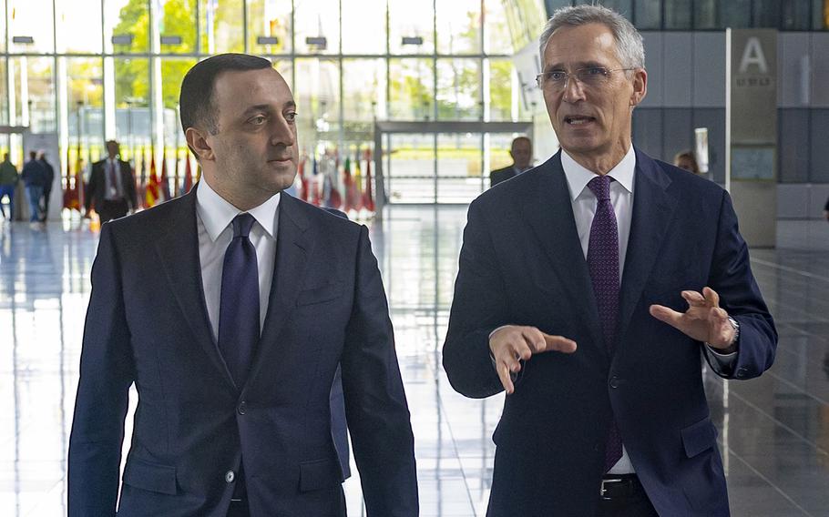 NATO Secretary-General Jens Stoltenberg, right, meets with the prime minister of Georgia, Irakli Garibashvili, at NATO headquarters in Brussels, on April 24, 2023. Stoltenberg recently described Georgia as one of NATO’s closest partners.