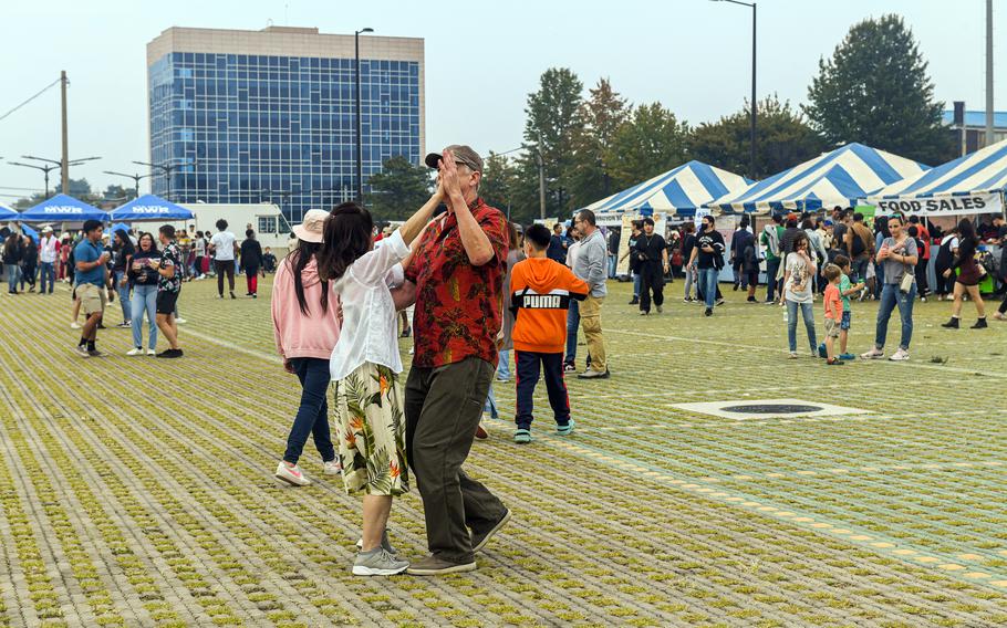 People gather and dance on Balboni Field during the Humphreys Fall Festival at Camp Humphreys, South Korea, Oct. 15, 2022.