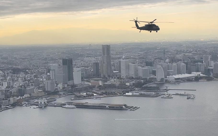 A U.S. Army UH-60L Black Hawk flies over Tokyo Bay near Yokohama, Japan, Tuesday, Jan. 17, 2023.