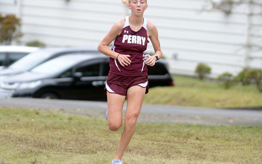 Matthew C. Perry junior Jane Williams makes her way toward the finish line. She was third overall and first among DODEA All-Japan runners.