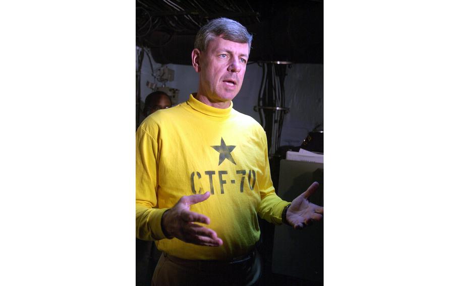 Rear Adm. Steve Kunkle, commander of the Kitty Hawk Battle Group, talks with reporters Monday, April 15, 2002, in his Task Force Command Center aboard the USS Kitty Hawk.