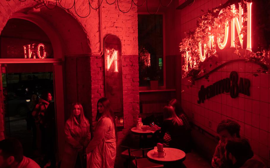 Anastacia Osmolovska, left, and Viktoria, right, visit a bar in central Kyiv on Nov. 12. 