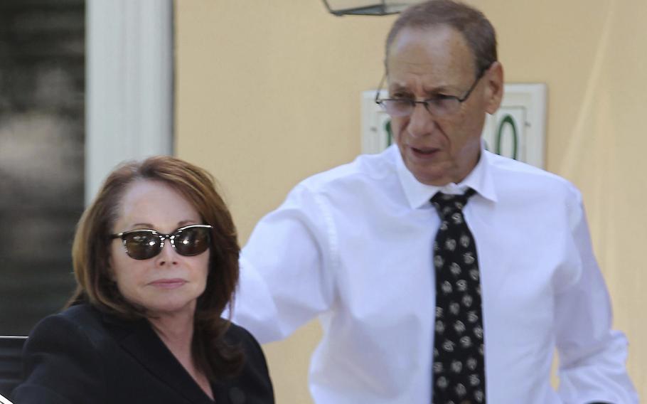 Shirley Sotloff and her husband, Arthur B. Sotloff, exit a car as they return home after a memorial service for their son, slain journalist Steven Sotloff, at Temple Beth Am, on Sept. 5, 2014, in Pinecrest, Fla. The Sotloff family filed a federal lawsuit Friday, May 13, 2022, accusing prominent Qatari institutions of wiring $800,000 to an Islamic State “judge” who ordered Steven Sotloff’s and Foley’s murders.