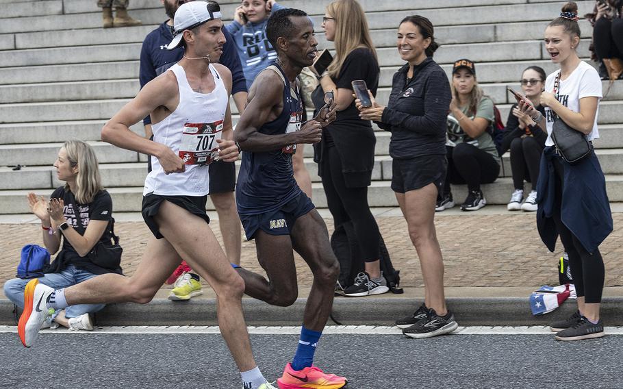 Action near the 10-mile mark of the 48th Marine Corps Marathon on Sunday, Oct. 29, 2023, in Arlington, Va.