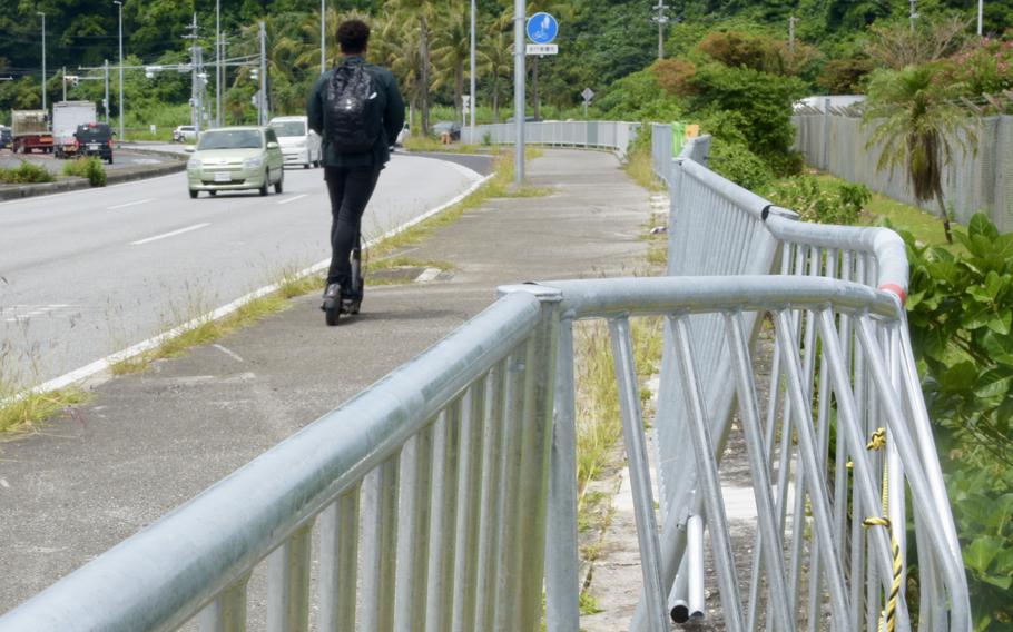 Fence damage from a fatal weekend collision is seen outside Camp Foster, Okinawa, Tuesday, May 10, 2022. 