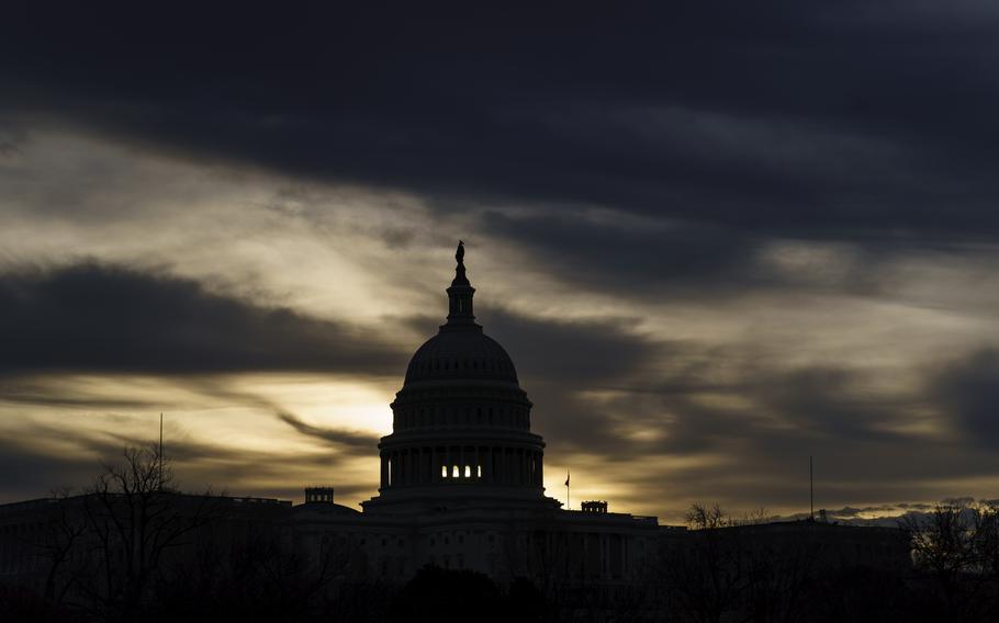 The U.S. Capitol is seen in Washington, early Dec. 17, 2021. President Joe Biden faces a steep path to achieve his ambitious goal to slash planet-warming greenhouse gas emissions in half by 2030, as a $2 trillion package of social and environmental initiatives remains stalled. Biden’s Build Back Better plan, which contains $550 billion in spending and tax credits aimed at promoting clean energy, was sidetracked by Democratic Sen. Joe Manchin, who said just before Christmas that he could not support the legislation as written.