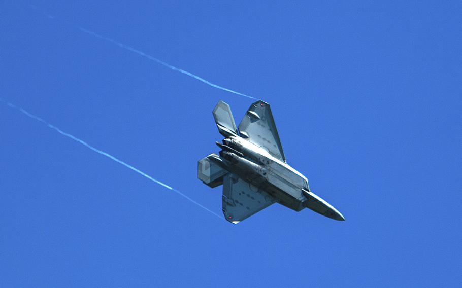 An F-22 Raptor takes part in a training exercise held at Volk Field, Wisc., on Aug. 12, 2020. An Illinois hobby group is wondering if one of the unidentified flying objects shot out of the sky by a jet fighter’s sidewinder missile that costs upwards of $450,000 might have been their humble radio-equipped balloon, which could cost as little as $12.