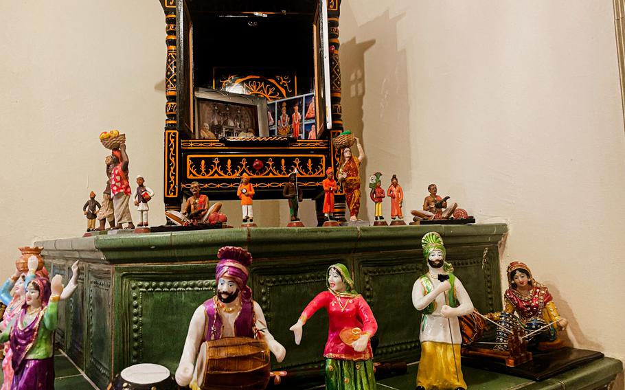 Assorted figurines occupy one corner of the dining room at Curry House, an Indian restaurant in Kaiserslautern, Germany.