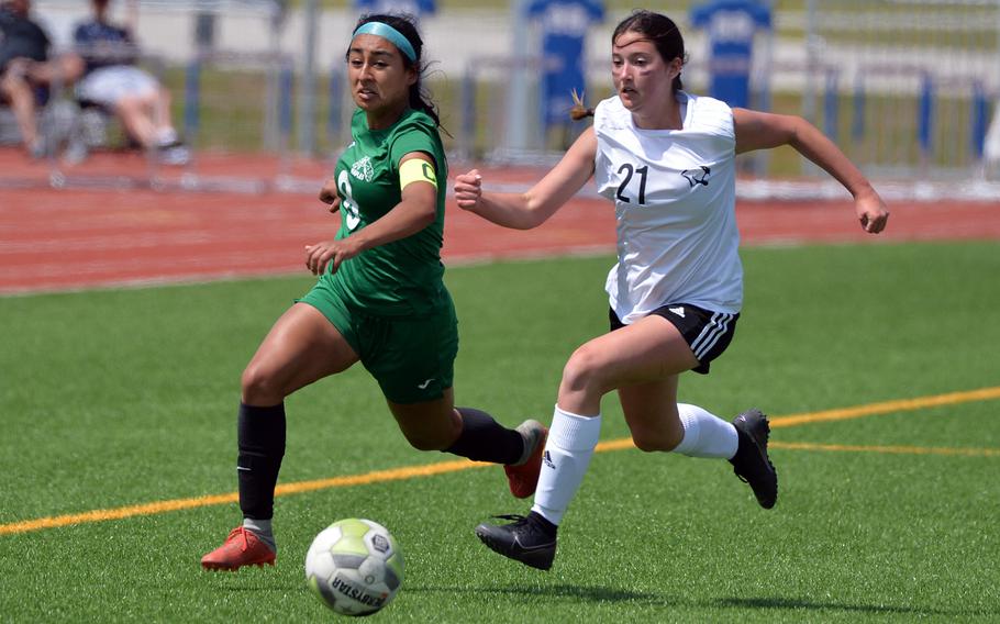 Nadia Shimasaki drives the ball up the field against Vicenza’s Brooklyn Jenni in the Division II girls final at the DODEA-Europe championships at Ramstein, Germany, May 18, 2023. Naples took the title, winning 3-1, with Shimasaki scoring two goals.