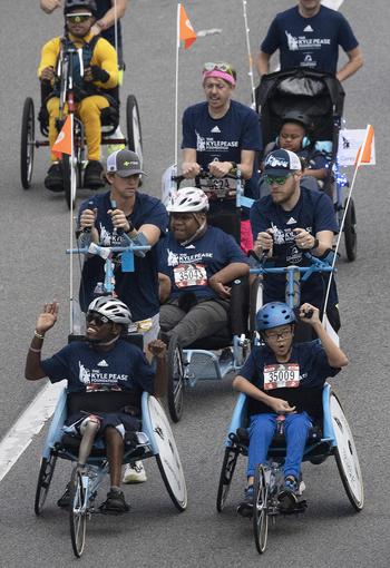Wheelchair and hand-crank competitors start the 48th Marine Corps Marathon, on Sunday, Oct. 29, 2023, in Arlington, Va.