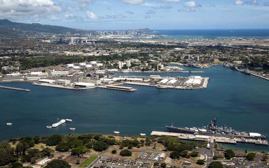 An aerial view of Joint Base Pearl Harbor-Hickam, Hawaii, with Diamond Head, Honolulu and Waikiki in the distance.