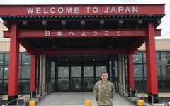 Air Force Capt. Cody Byford, the 730th Air Mobility Squadron logistics and readiness officer at Yokota Air Base, Japan, stands before a torii, part of a $27.5 million renovation of the Yokota Passenger Terminal, on June 16, 2022. 