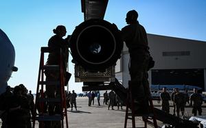 U.S. Air Force Master Sgt. Marcella Philips, 2nd Maintenance Group weapons standardization loading standardization crew chief, and Tech Sgt. Darrell Stewart, 307th Aircraft Maintenance Squadron loading standardization crew member, secure the Air-Launched Rapid Response Weapon to the B-52H Stratofortress ejector rack, at Barksdale Air Force Base, Louisiana, November 2, 2022. The ARRW is the first U.S. Air Force hypersonic weapon and is scheduled to be operational in fall of 2023. (U.S. Air Force photo by Airman Nicole Ledbetter)