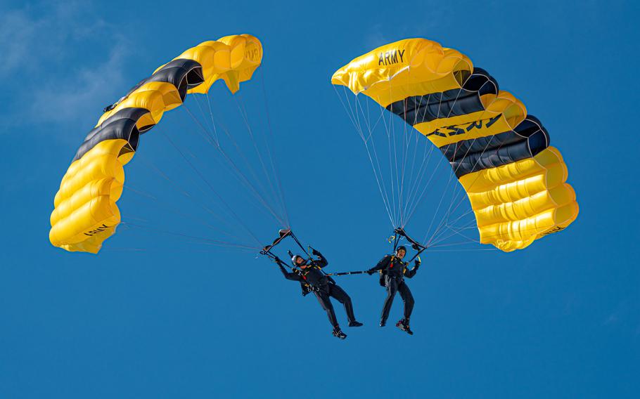 Soldiers fly a canopy formation onto Miami Beach