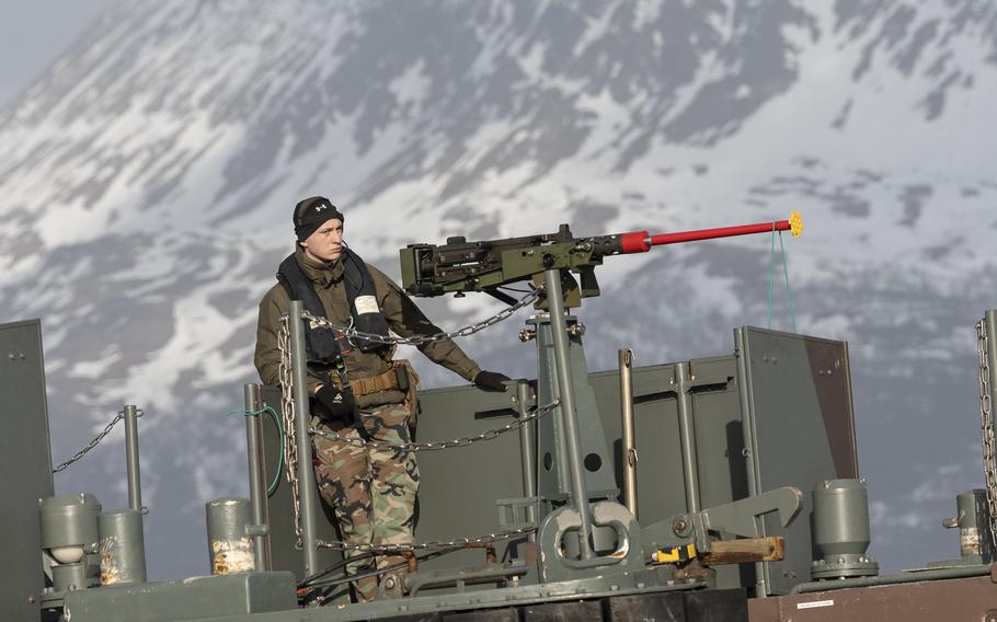A Dutch service member works aboard the HNLMS Rotterdam during an amphibious landing exercise with U.S. Marines in Sandstrand, Norway, on Monday, March 21, 2022.