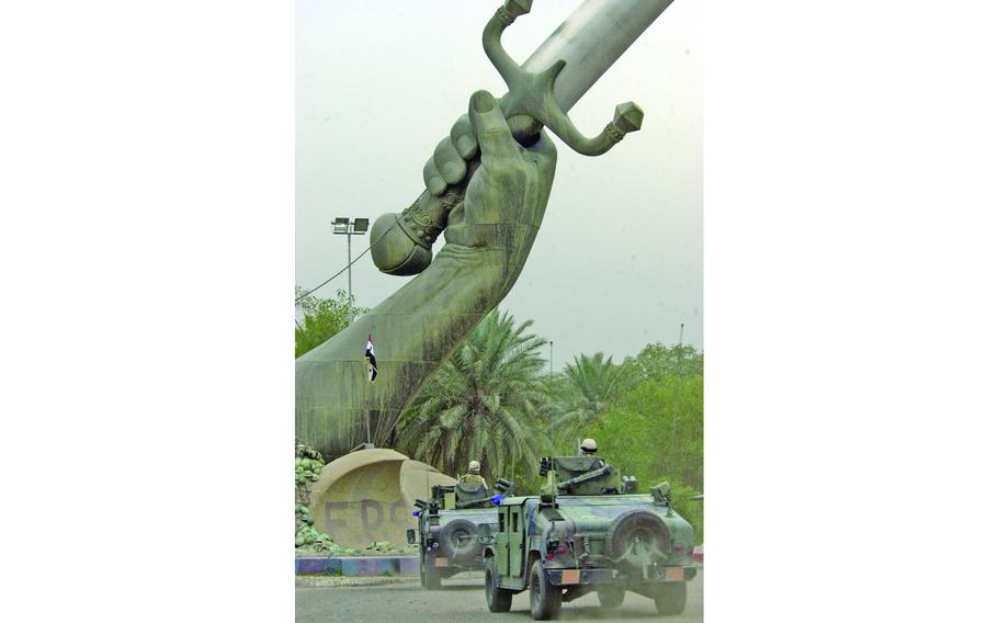 DVIDS - News - Soldiers re-up under Crossed Swords monument