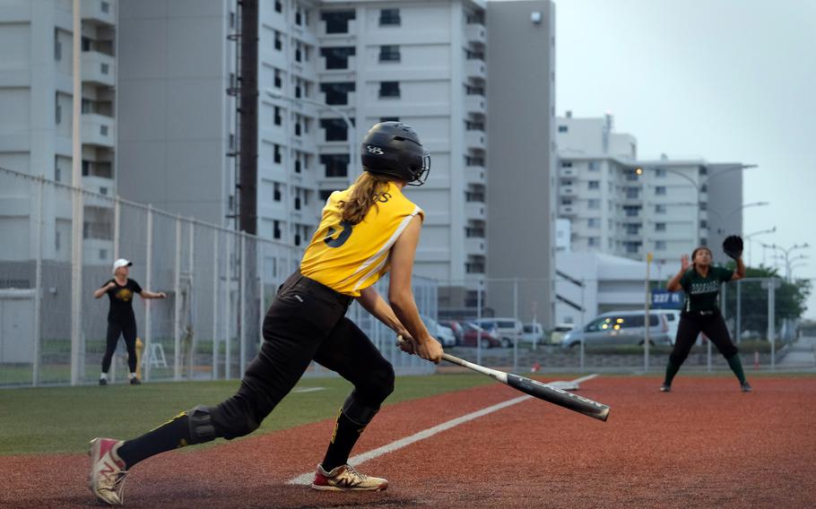 Kadena's Morgan Sayers ropes a double to left field, one of four extra-base hits she got in Saturday's two final games.