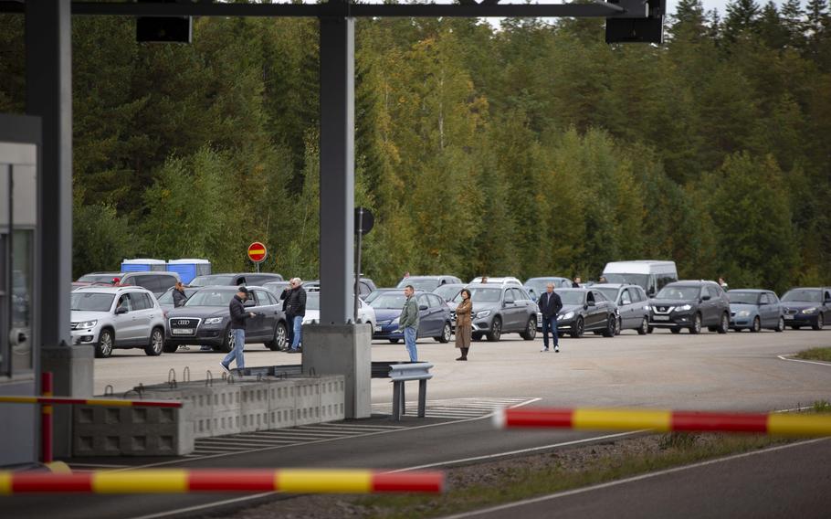 Cars queue to cross the border from Russia to Finland at the Vaalimaa border check point in Virolahti, Finland, Friday Sept. 23, 2022. 