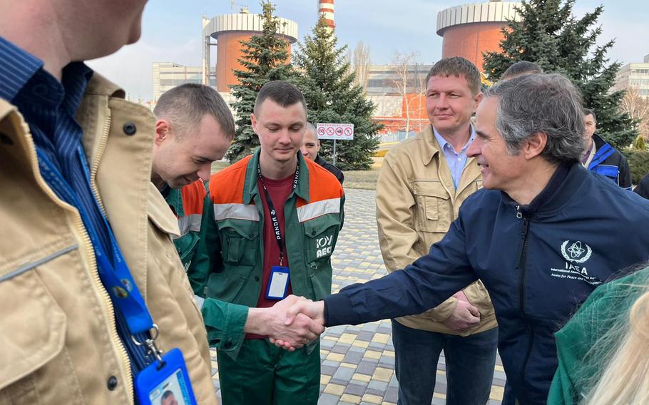 International Atomic Energy Agency Director General Rafael Grossi greets employees of a nuclear power plant in southern Ukraine, on Wednesday, March 30, 2022. 