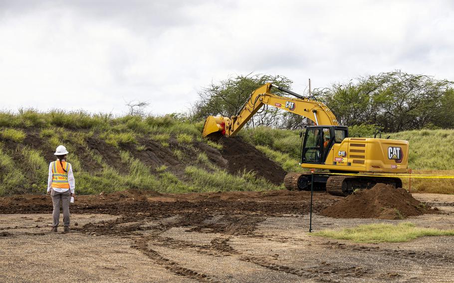 A backhoe moves earth on an impact berm at the Pu’uloa Range Training Facility, Ewa Beach, Hawaii, Feb. 23, 2023.