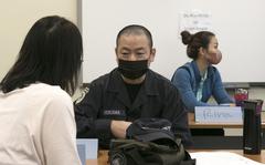 Japanese master labor contract employees work in groups during "continuous process improvement" training at Kadena Air Base, Okinawa, March 15, 2022. 