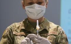 U.S. Air Force Tech. Sgt. Allison Turner, 88th Healthcare Operations Squadron, fills a syringe with the COVID-19 vaccine Jan 8, 2021, at Wright-Patterson Air Force Base, Ohio. 